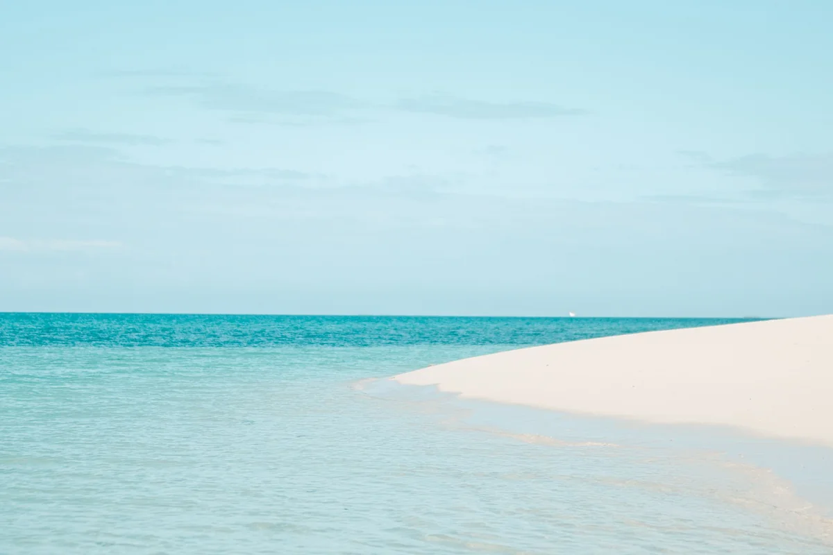White sand and clear turquoise Indian Ocean water in Zanzibar, Tanzania